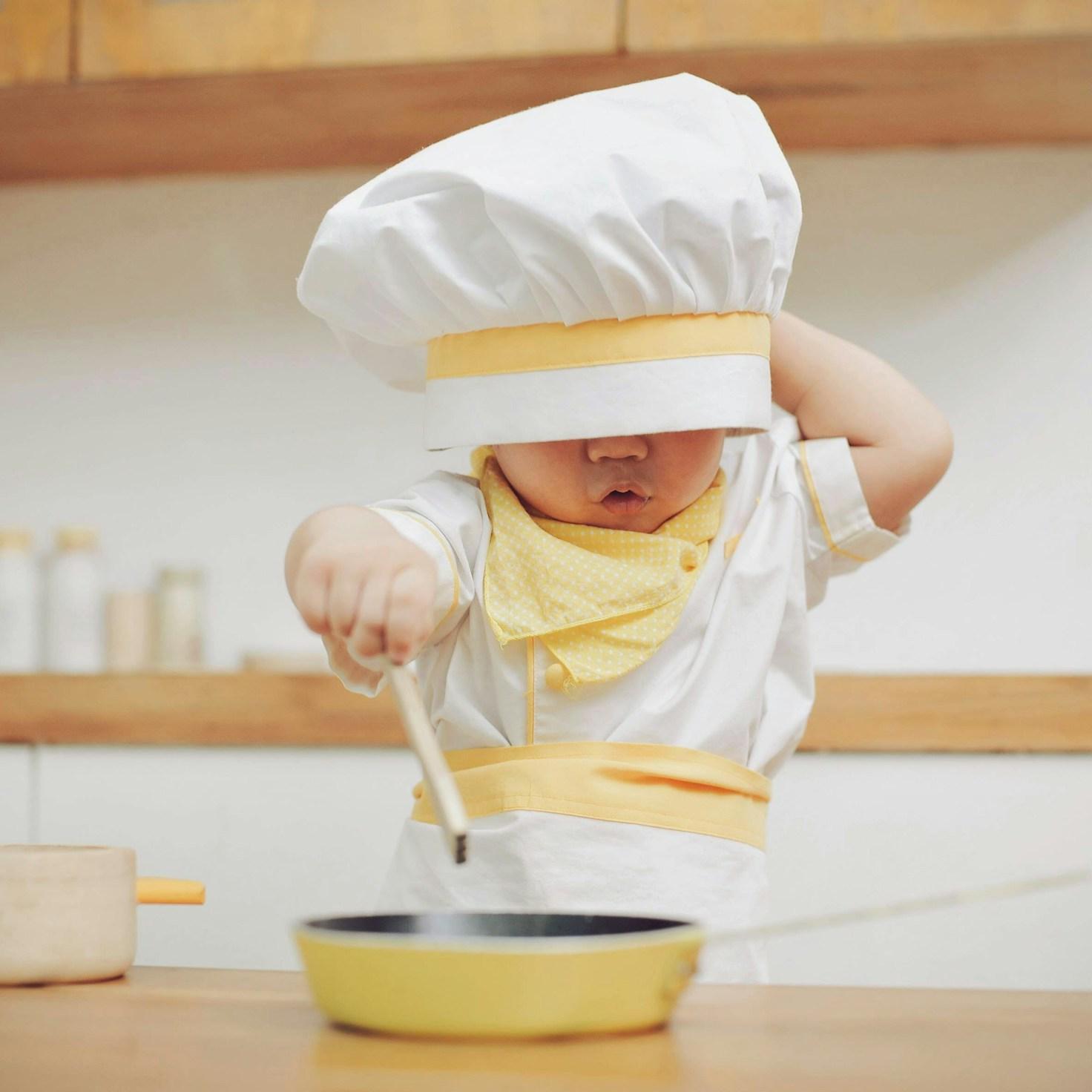 Diverse group of community members sharing a meal together, showcasing the social bonds formed through collaborative cooking